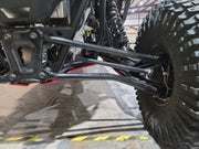 Trail Armor skid plate edge visible near rear A-arms on Polaris RZR Pro R 4