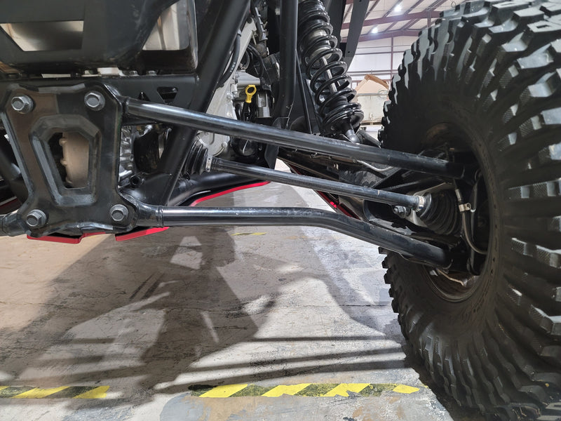 Trail Armor skid plate edge visible near rear A-arms on Polaris RZR Pro R 4
