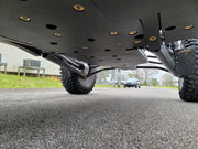 Close-up underside view of Trail Armor skid plate on Polaris RZR Pro R 4