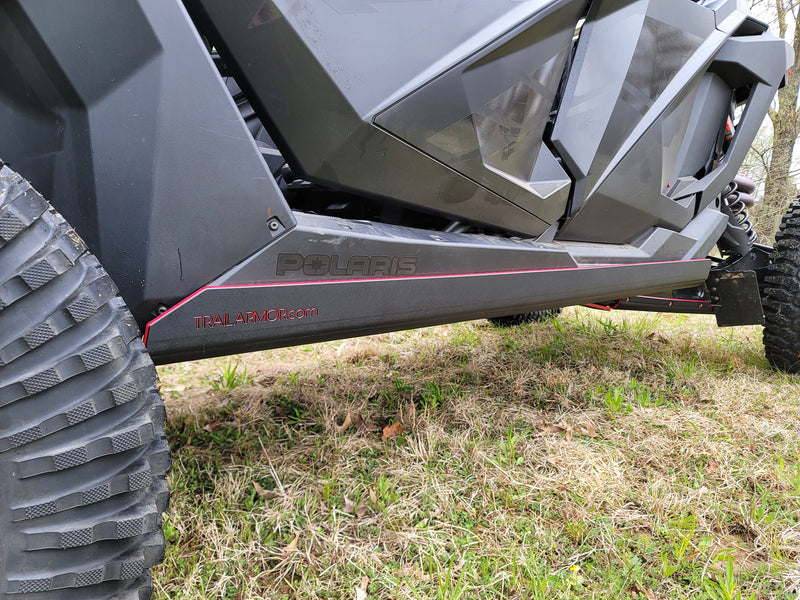 Close-up of Trail Armor skid plate branding on Polaris RZR Pro R 4 side