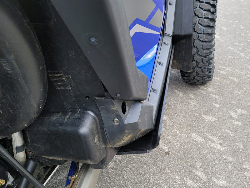 Close-up of Trail Armor rocker panel guard on Polaris RZR Pro R door area