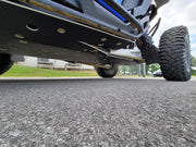 Low angle view of Trail Armor skid plate on blue Polaris RZR Pro R