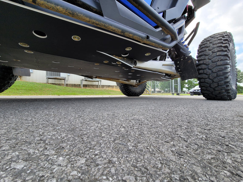 Low angle view of Trail Armor skid plate on blue Polaris RZR Pro R