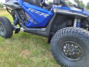 Trail Armor skid plate installed on blue Polaris RZR Pro R side view