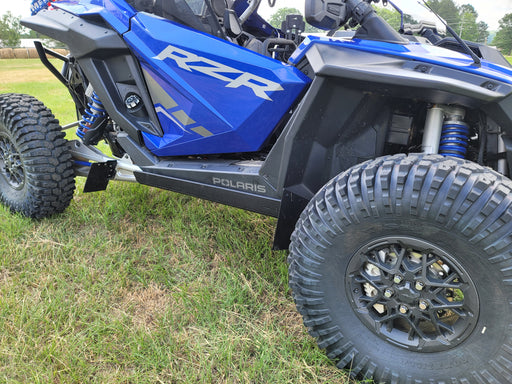 Trail Armor skid plate installed on blue Polaris RZR Pro R side view