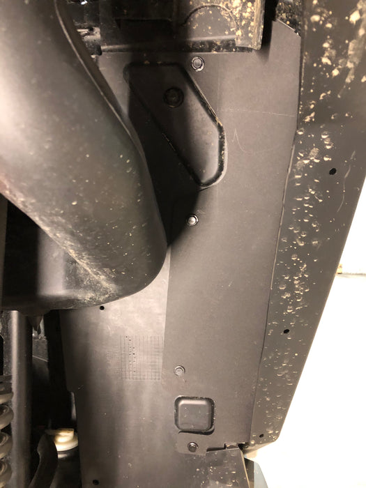 Close-up of Trail Armor inner fender liner mounted with hardware on RZR Pro XP
