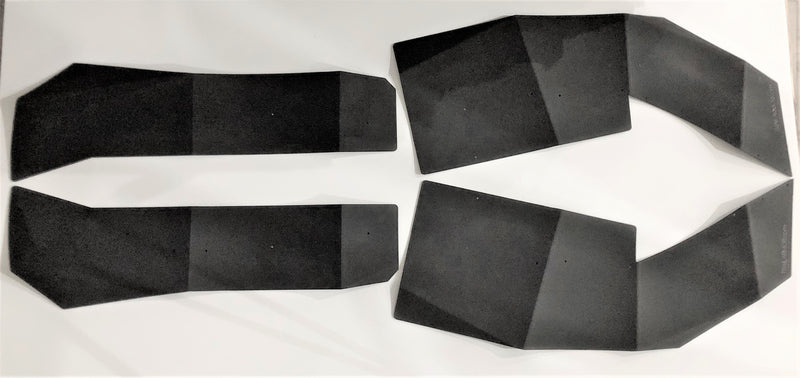 Full set of Trail Armor mud flap fender extensions for a Polaris RZR Pro XP, laid flat showing front and rear pieces with mounting holes