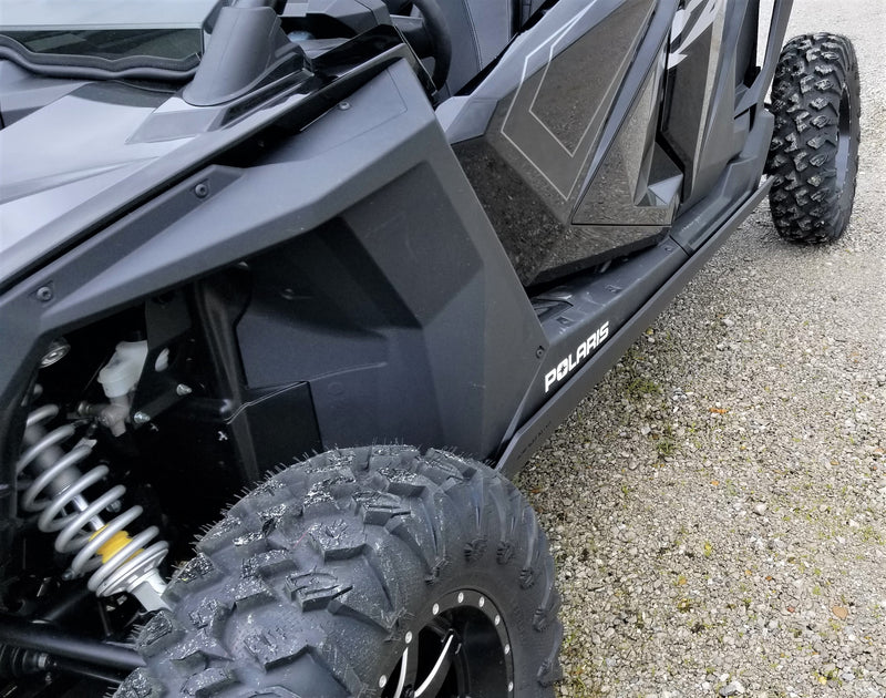 Close-up of Trail Armor nerf bar and skid plate on Polaris RZR XP Pro 4