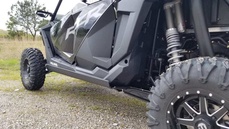 Trail Armor nerf bar installed under Polaris RZR XP Pro 4 rear angle view