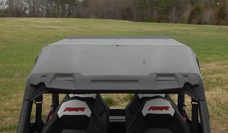 Trail Armor hard top roof installed on Polaris RZR XP 4 1000, front-facing view from behind seats