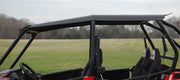 Trail Armor hard top roof installed on Polaris RZR XP 4 1000 roll cage, view from driver's seat outdoors