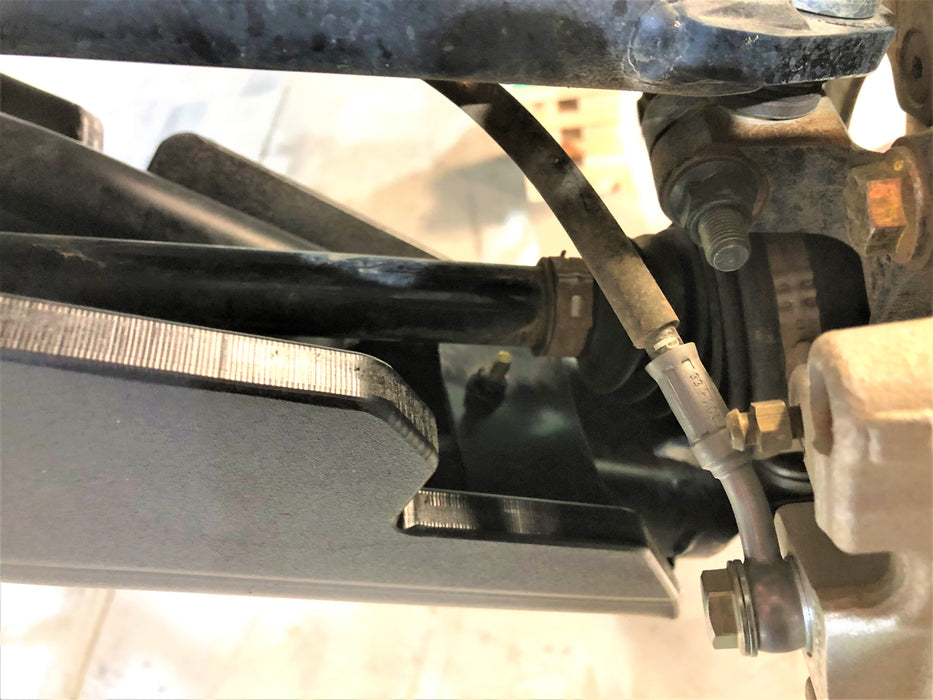 Trail Armor Ranger XP 1000 factory arched A-Arm guard installed, textured edge near shock