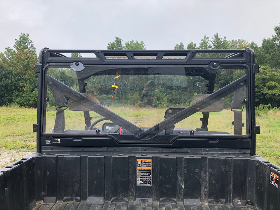 Trail Armor Ranger XP rear window dust shield installed, outdoor daylight view from bed