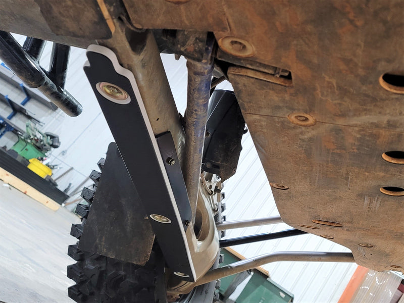 Trail Armor RZR PRO R trailing arm guard installed, front mounting bracket near pivot point