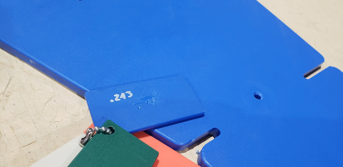 Trail Armor Super Tough Polymer skid plate shown in blue color option outdoors