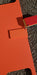Trail Armor Super Tough Polymer skid plate shown in orange color option outdoors
