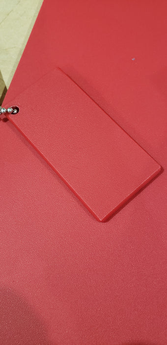 Trail Armor Super Tough Polymer skid plate shown in red color option outdoors