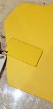 Trail Armor Super Tough Polymer skid plate shown in yellow color option outdoors