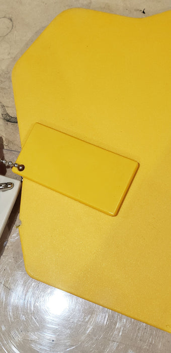 Trail Armor Super Tough Polymer skid plate shown in yellow color option outdoors